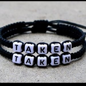 A pair of black bracelets taken